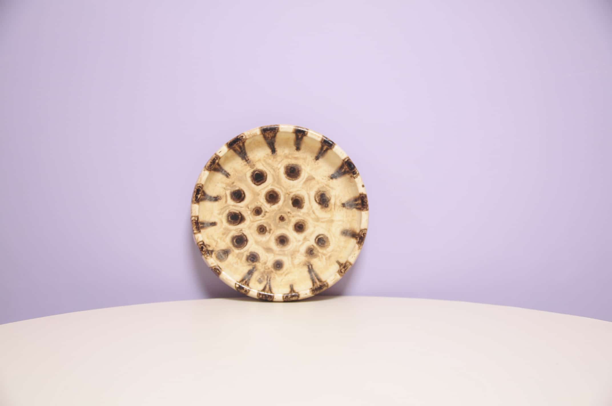 Beige round bowl with dots