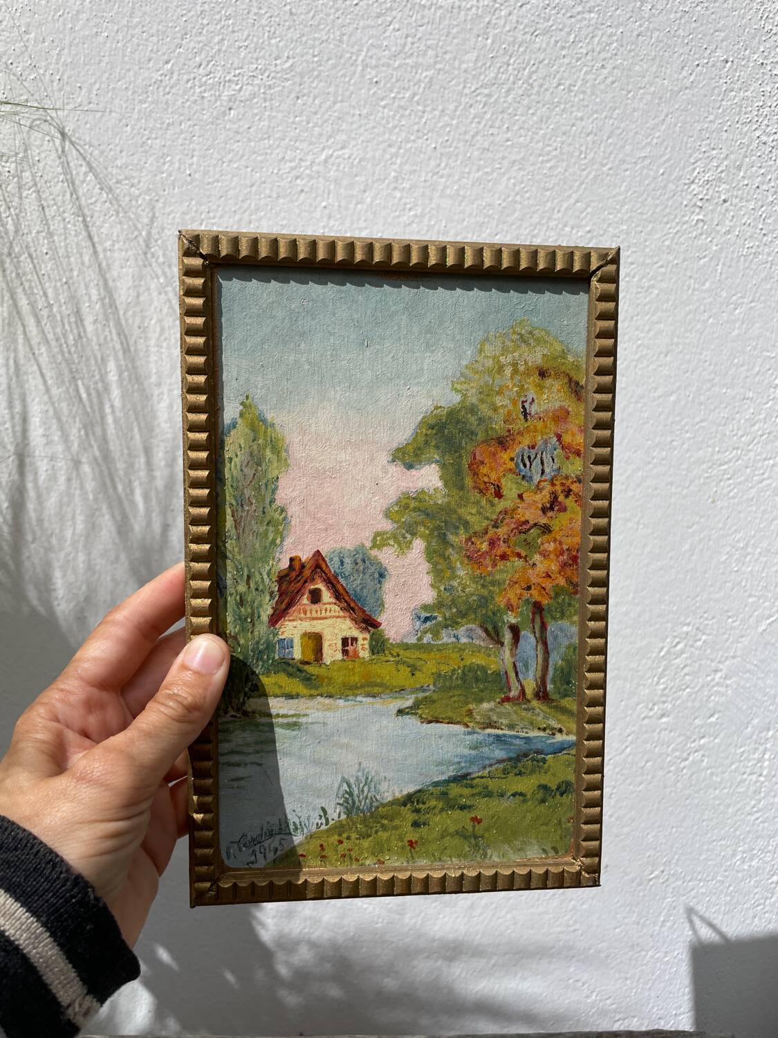 Small landscape painting with golden frame