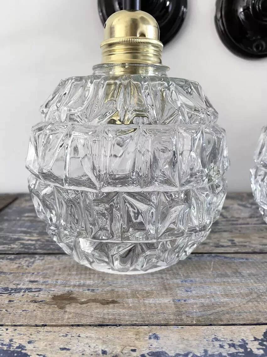 Pair of chiseled glass wall sconces