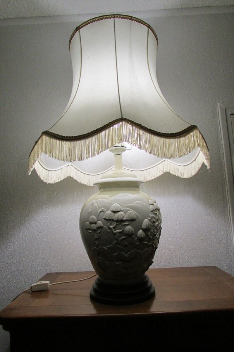 Pair of relief enameled porcelain lamps, Asian motif