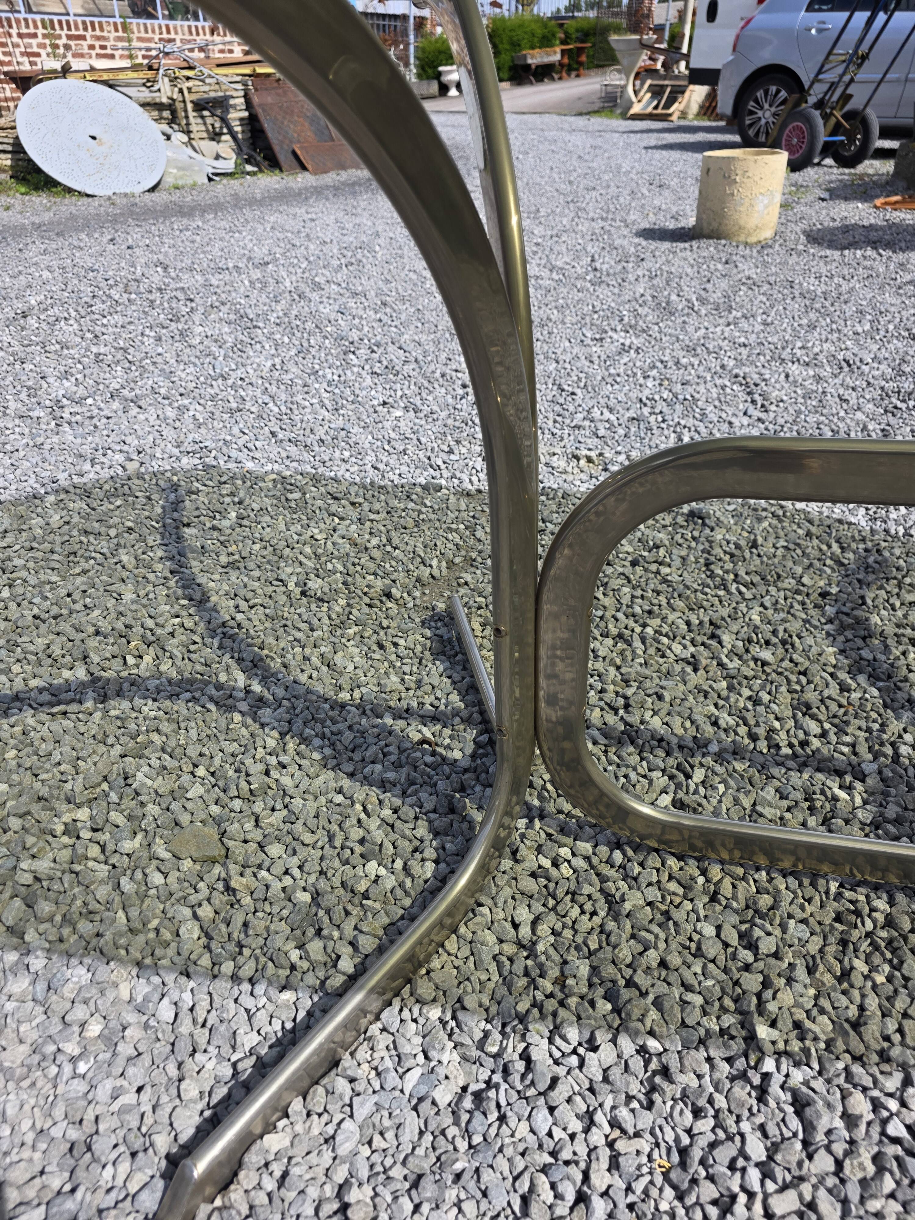 Silver metal table with smoked glass top from the 1970s.