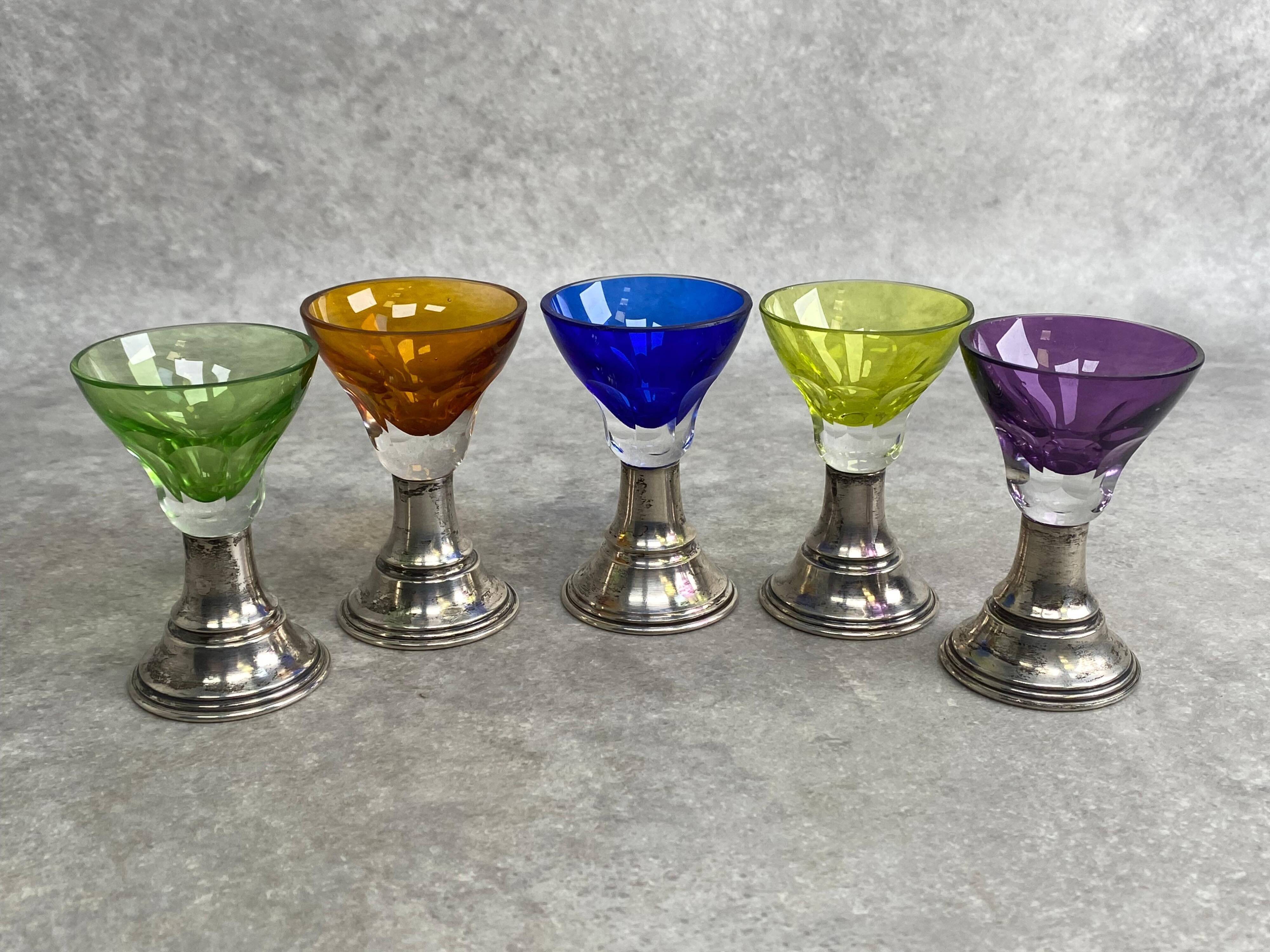 Set of 5 coloured stemmed glasses on silver stems.