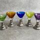 Set of 5 coloured stemmed glasses on silver stems.