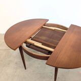 Round extendable wooden dining table