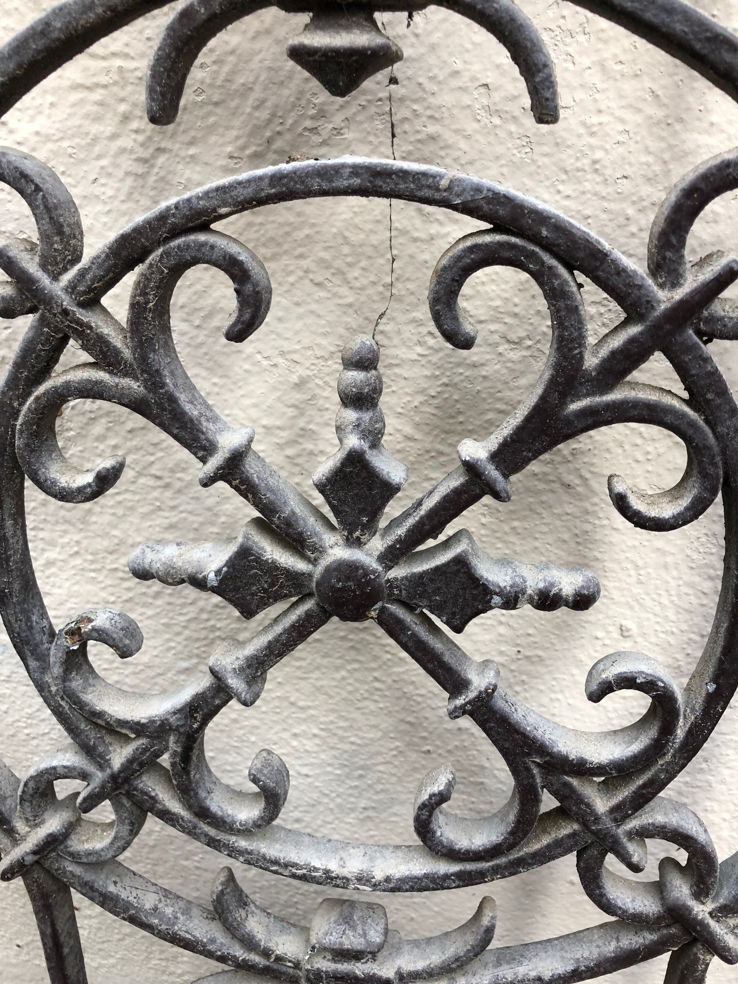 Pair of old cast iron door grilles