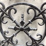 Pair of old cast iron door grilles