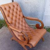 Chesterfield armchair in wood and leather