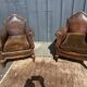 Pair of club armchairs in wood and leather, early 20th century.