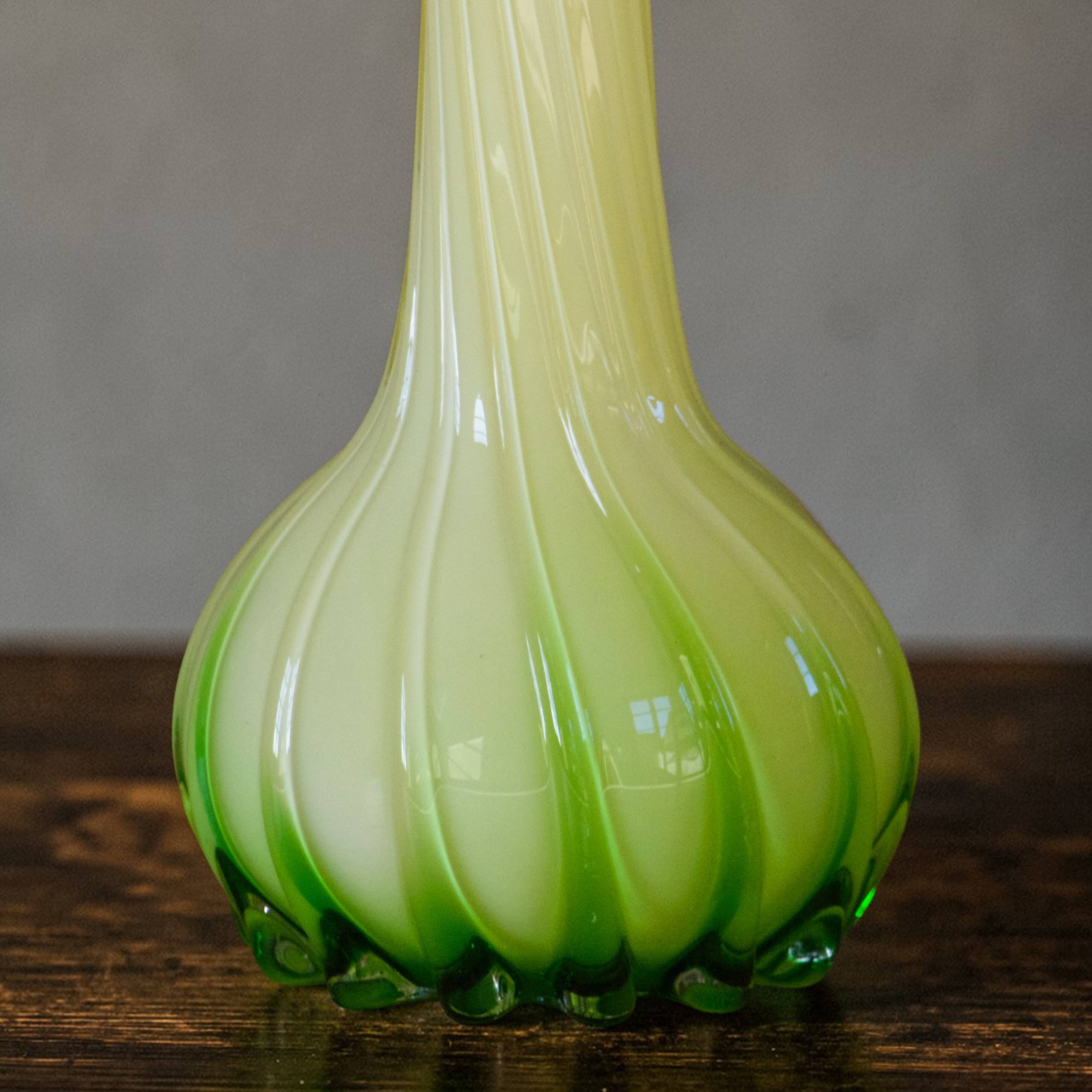 Blown glass vase from Murano in the shape of a yellow flower.