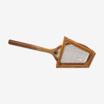 Old wooden tennis racket with frame