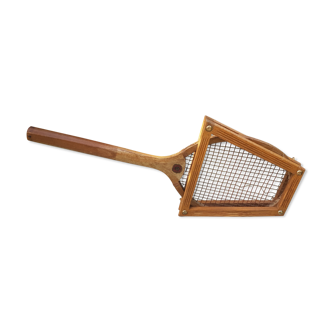 Old wooden tennis racket with frame