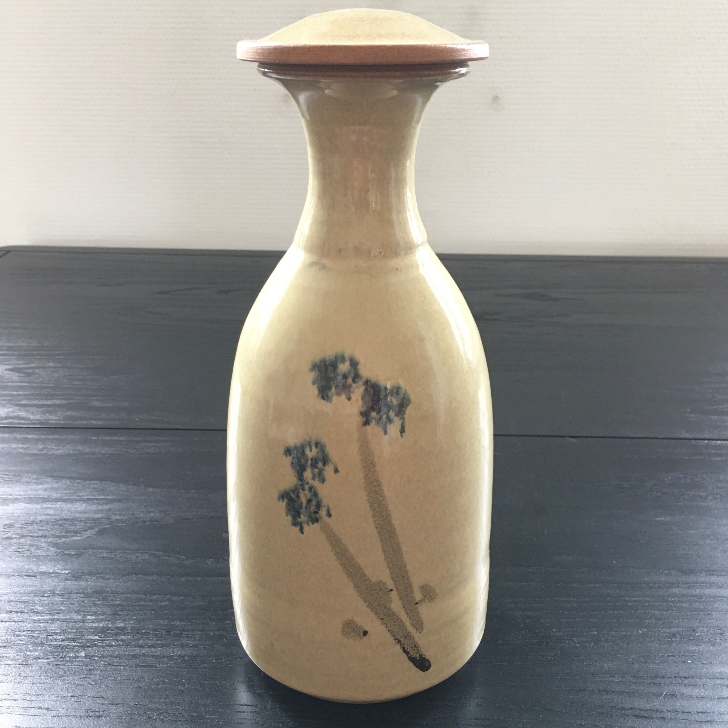 Stoneware carafe with floral decoration