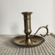 Old brass candlestick called "rat tail"