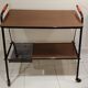 Red scoubidou handles wheeled serving table