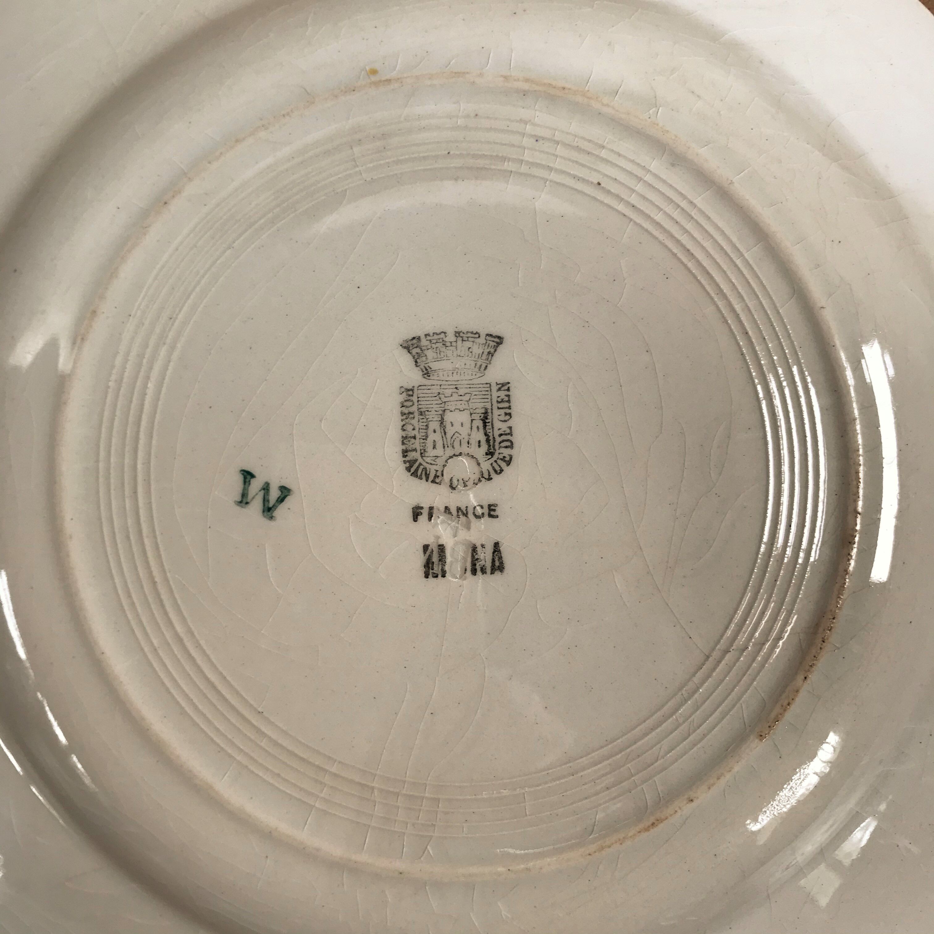 Four Gien porcelain plates