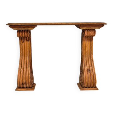 Old console in carved wood with scrolls