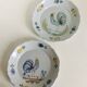 Pair of plates with naive Eastern rooster decoration