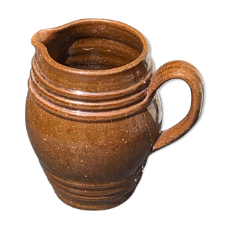 Pitcher old decanter in glazed sandstone