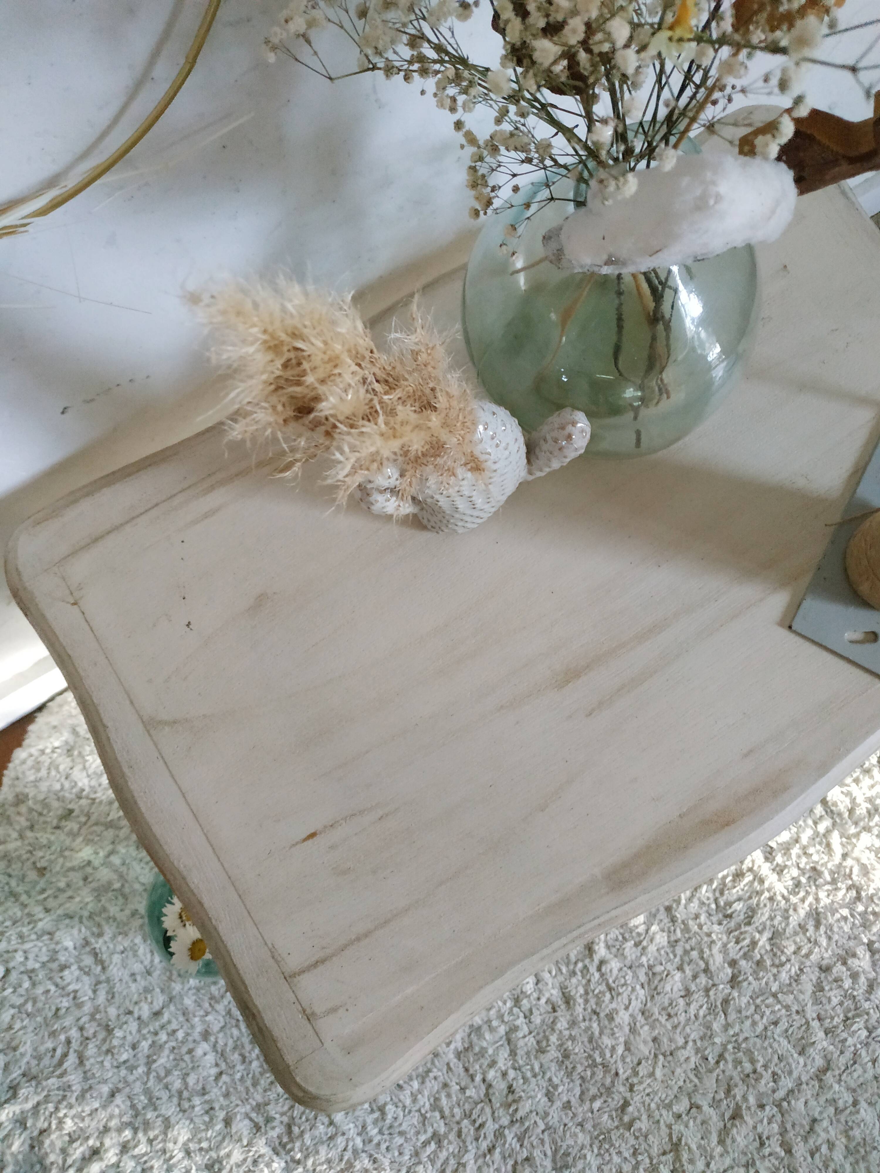 Old patinated coffee table and curved feet