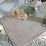 Old patinated coffee table and curved feet