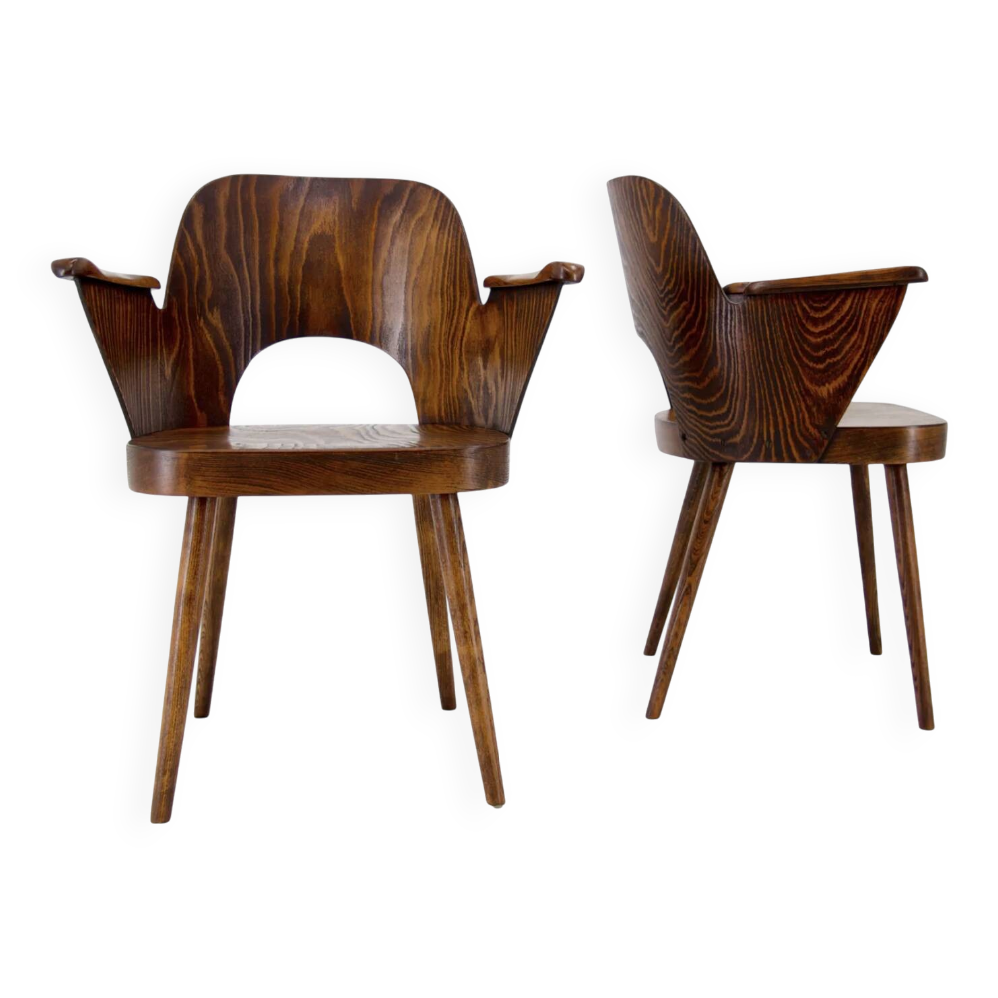 Pair of curved wooden shell armchairs in the style of Oswald Haerdtl.