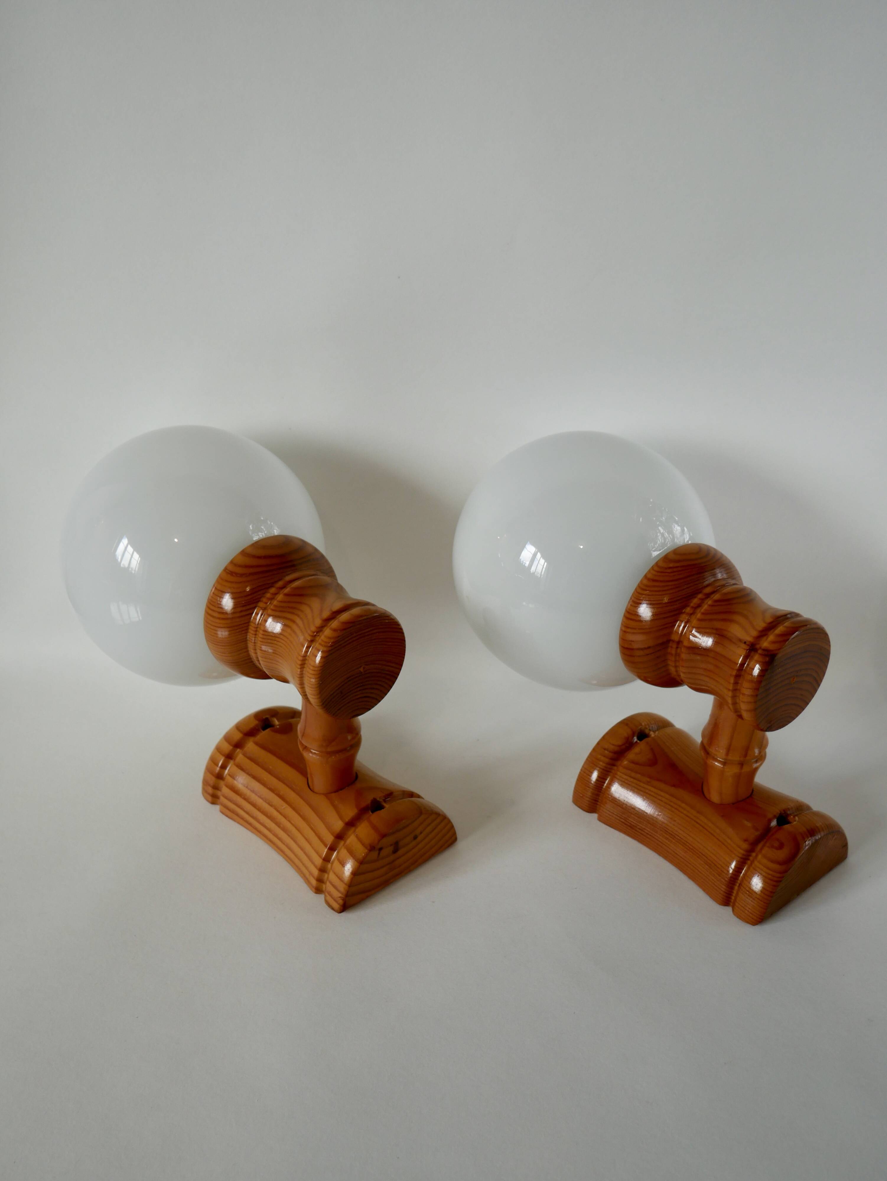 Pair of globe wall lights in pine and opaline from the 60s