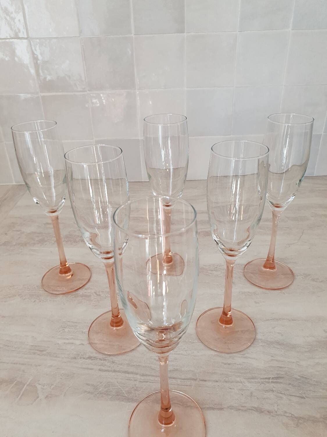 6 champagne flutes with pink stems