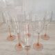 6 champagne flutes with pink stems