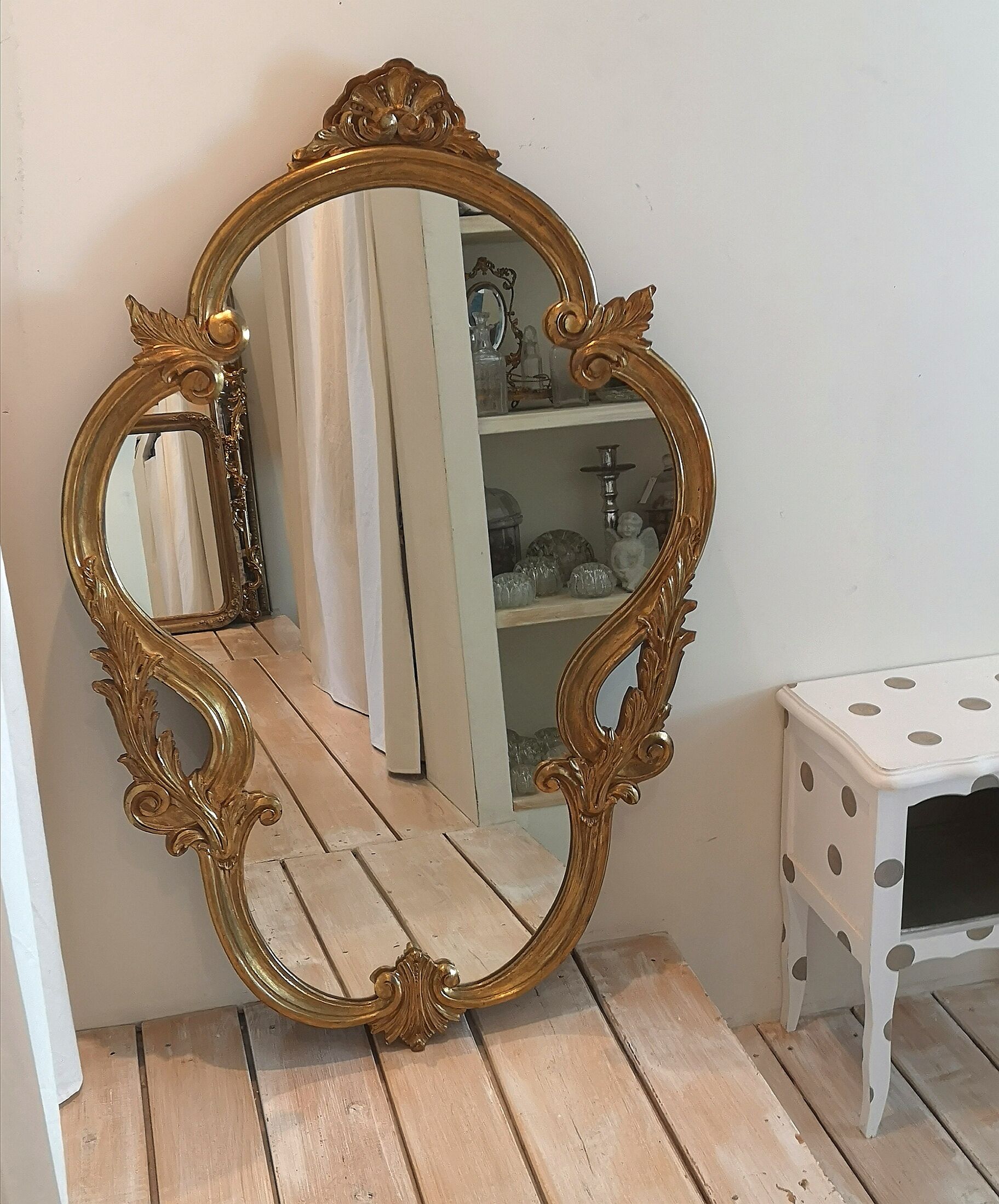 Elongated oval baroque gilded mirror