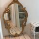 Miroir doré baroque ovale allongé