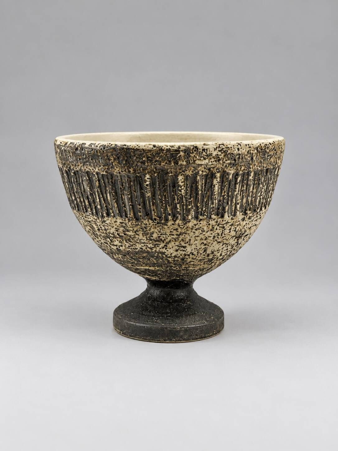 Vintage ceramic pedestal bowl – textured black and beige decor
