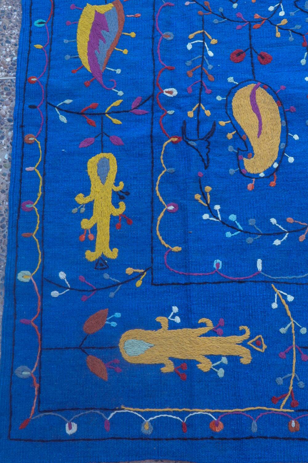 Midnight blue suzani kilim rug with embroidered patterns