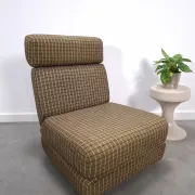 Vintage pull-out sofa bed, brown checked lounge chair with chrome.