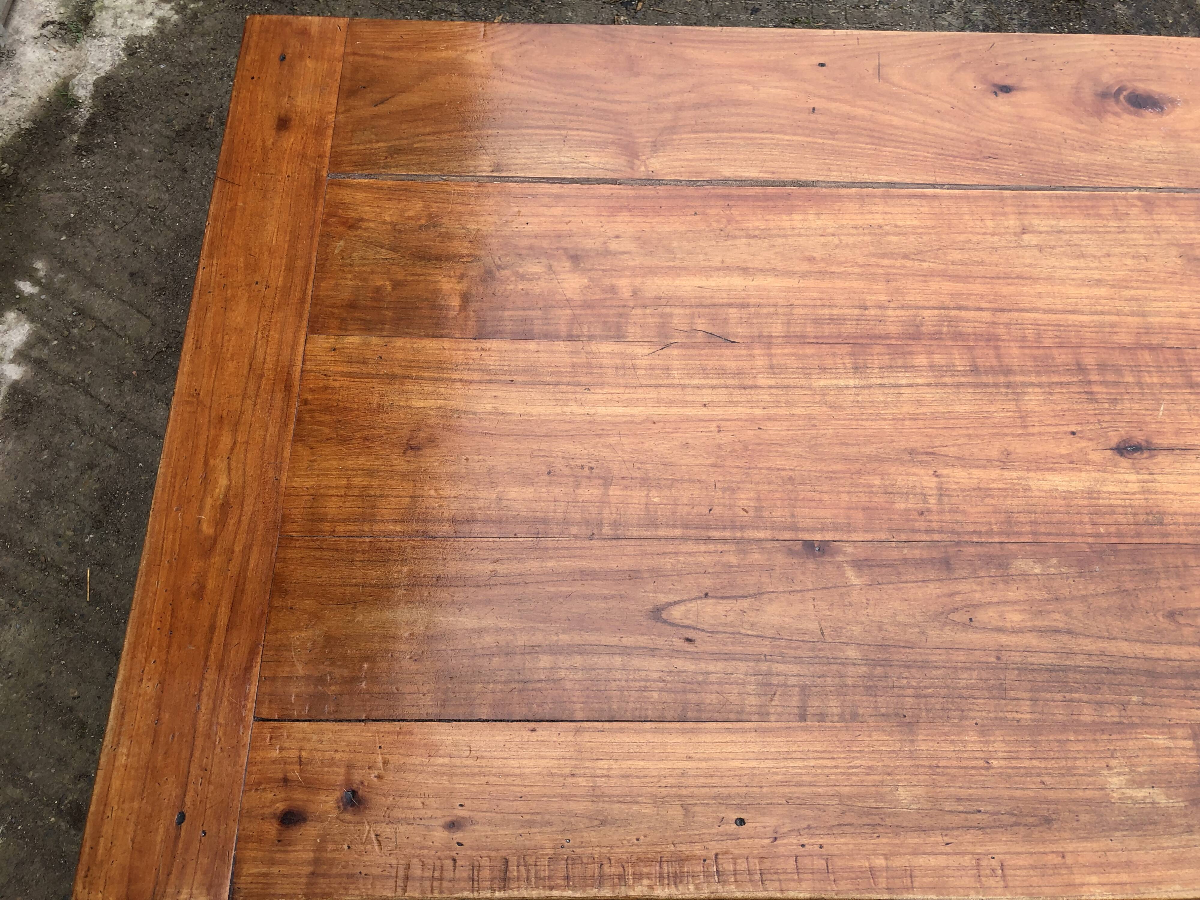 Antique farmhouse table in solid cherry wood with 3 drawers and 1 pull-out.