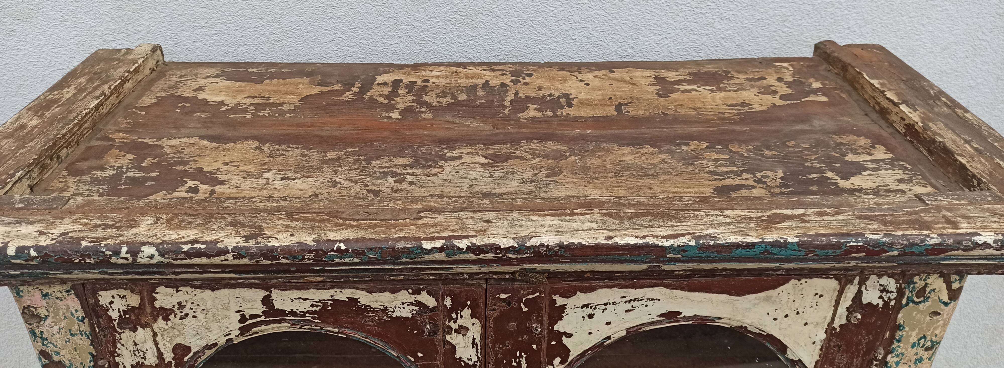 Old patinated wooden glass cabinet