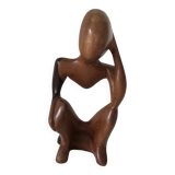 Wooden statuette sculpture of a thinking man design