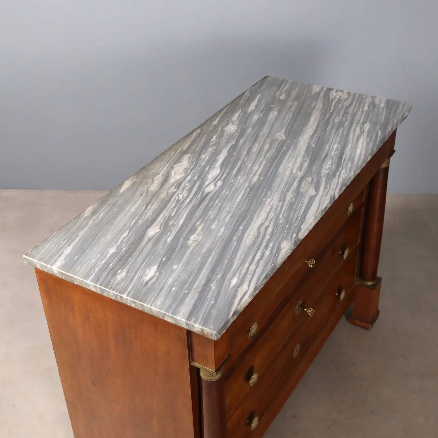 Antique Empire walnut and marble commode, 19th century.
