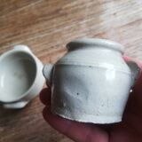 Set of 2 small glazed beige stoneware pots with handles