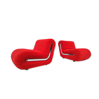 Pair of red boomerang-shaped lounge chairs