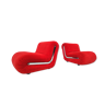 Pair of red boomerang-shaped lounge chairs