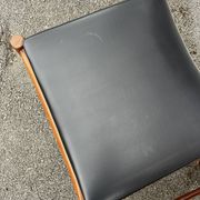 Set of 2 vintage Scandinavian chairs in wood and black faux leather.