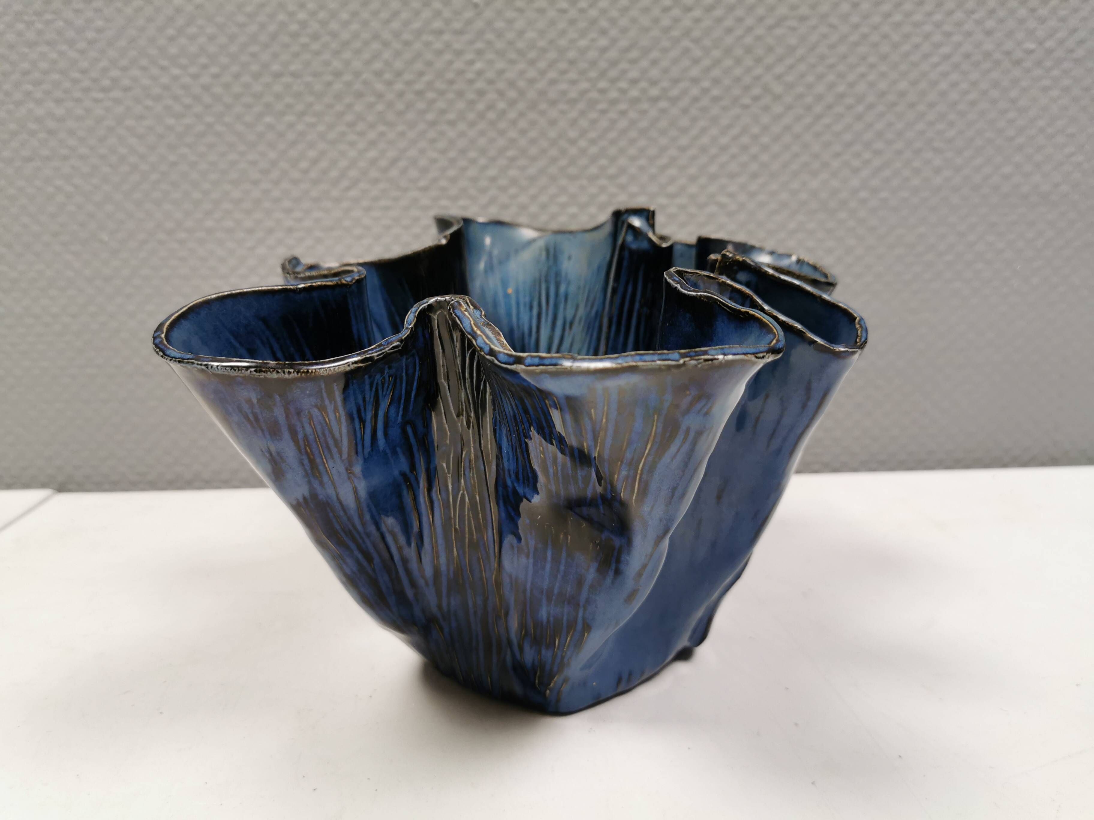 Very special vase in “folded” bluish glazed clay.