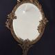 Art Deco hand-facing mirror in bronze and beveled ice