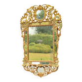 Baroque-style mirror in carved and gilded wood, Austro-Hungarian Empire, early 19th century.