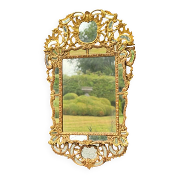 Baroque-style mirror in carved and gilded wood, Austro-Hungarian Empire, early 19th century.