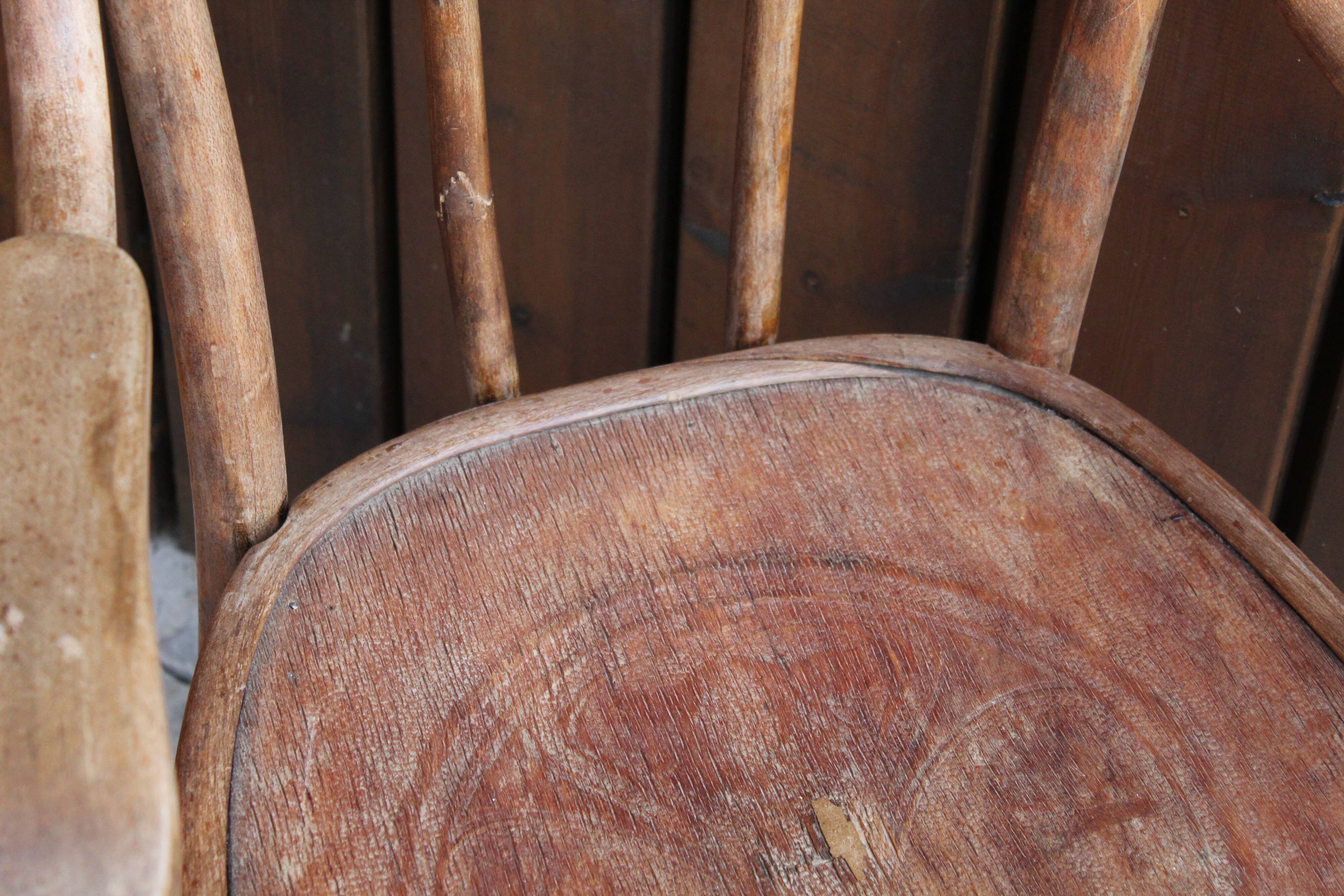 Curved wooden armchair
