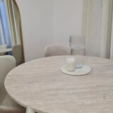 Omega circular dining table in natural travertine