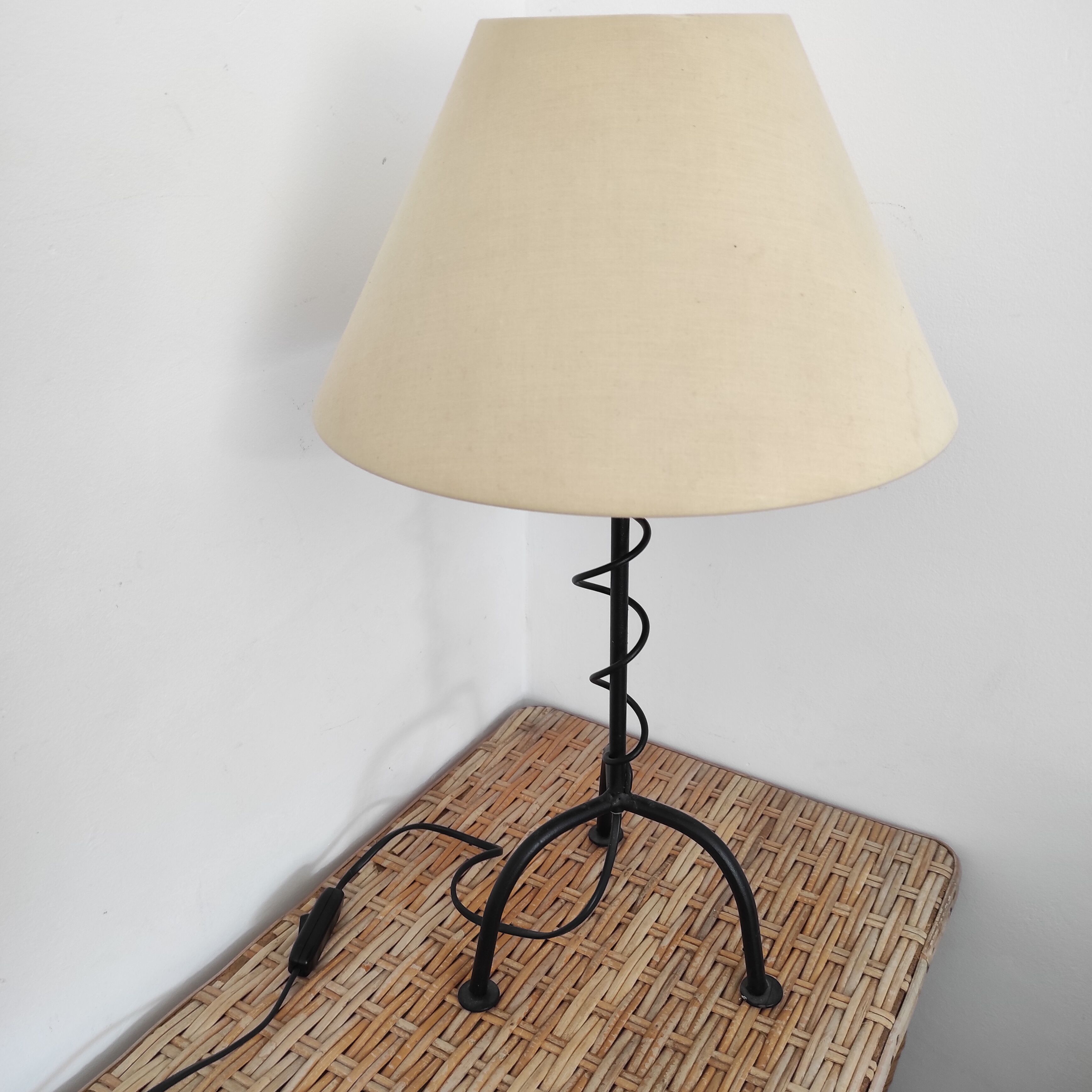 Black wrought iron table lamp and beige lampshade