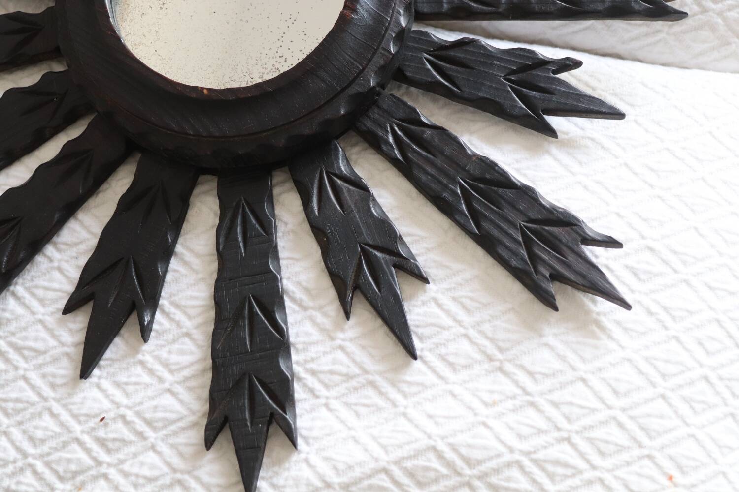 Antique black wooden sun mirror