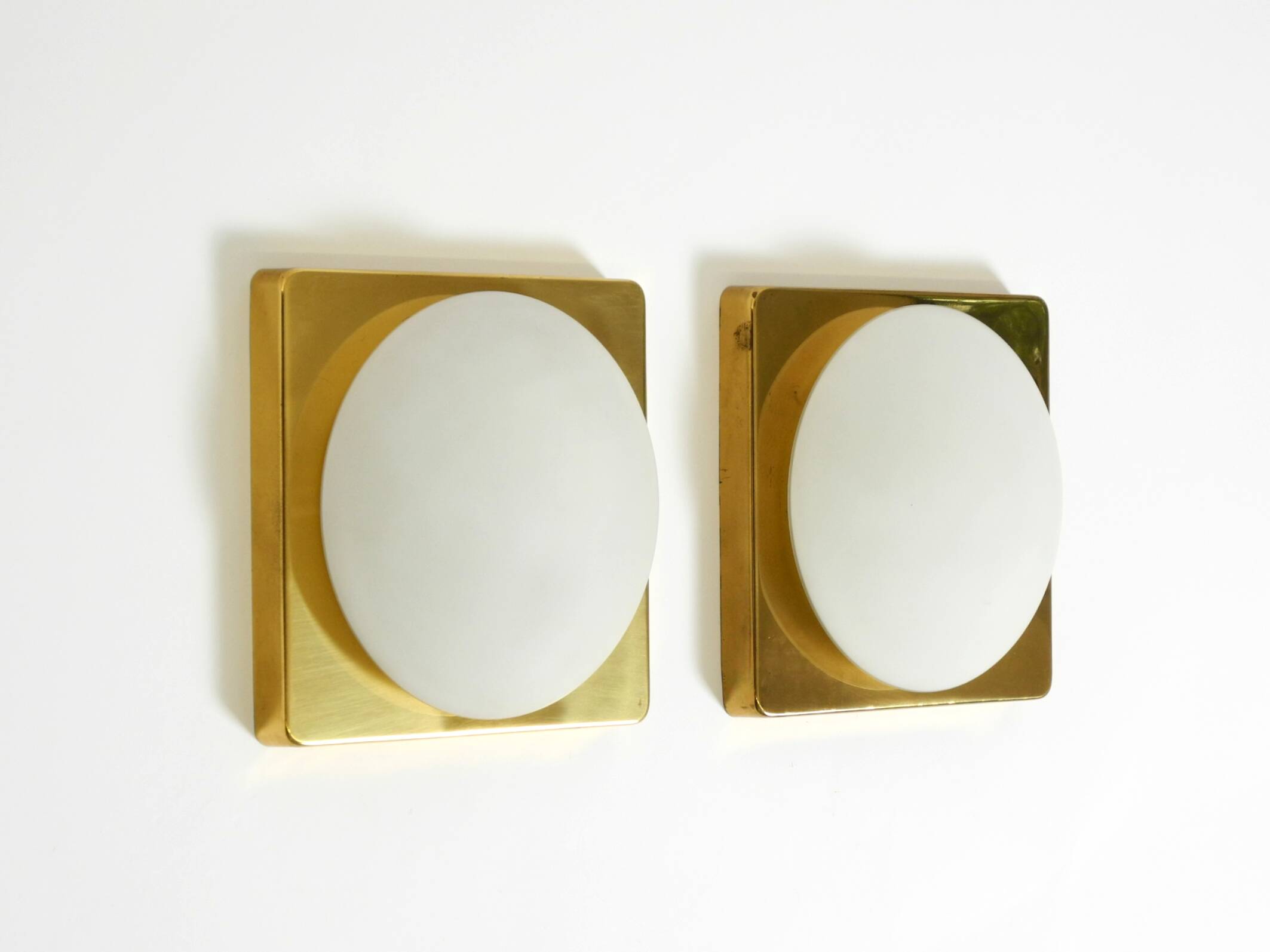 Two 1970s brass wall lamps by Rolf Krüger for Heinz Neuhaus Leuchten